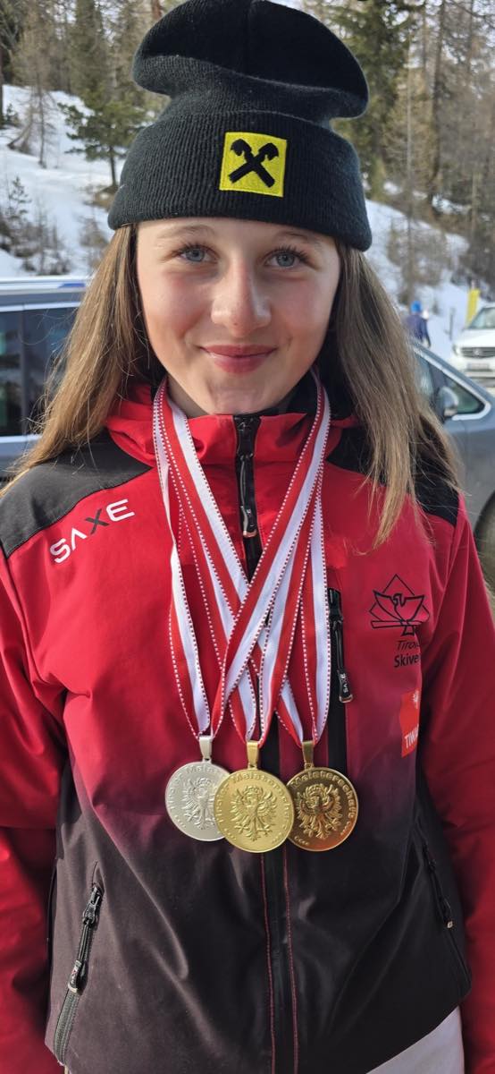 Ski Race Academy Mals athlete wearing medals after racing