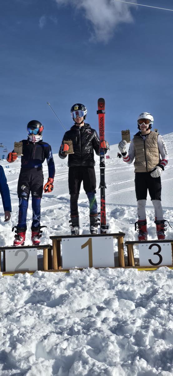Ski Race Academy Mals athletes on a snowy race podium